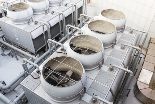 What is a water treatment system in cooling towers