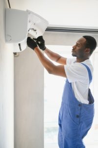 What should you do if a portable AC unit is leaking