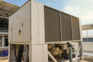 Why should facilities plan before peak cooling season?